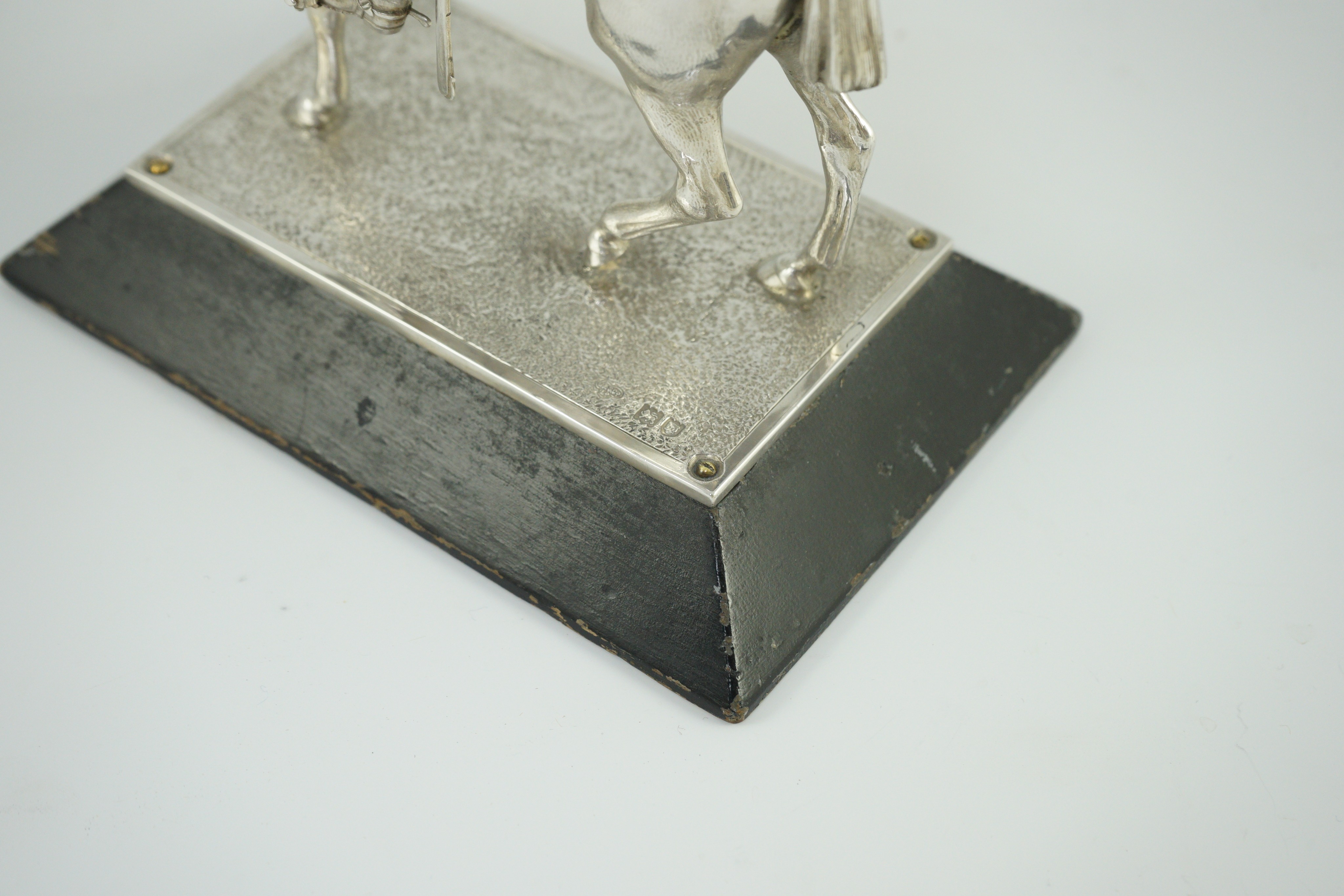 An early 20th century miniature model of a Royal Lancer on horseback, by The Goldsmiths and Silversmiths Co Ltd